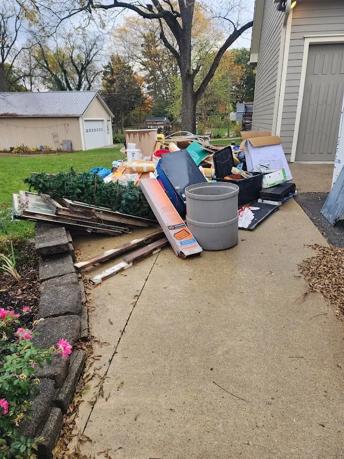 Dumpster being loaded with debris for 3 Yard Dumpster Rental in Enumclaw